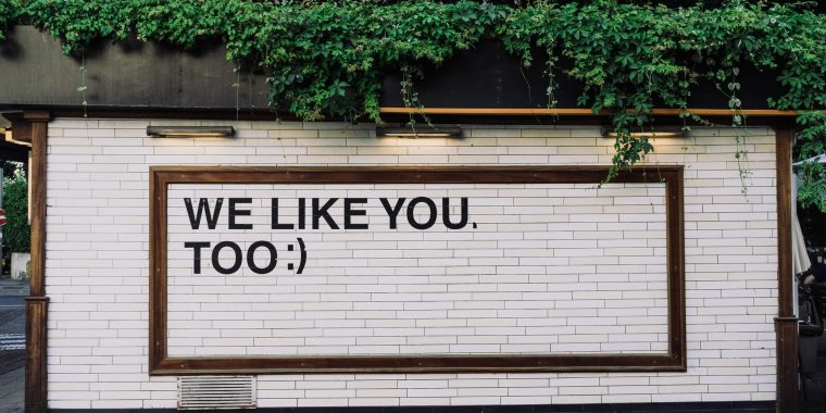 white wall with text: We Like You Too